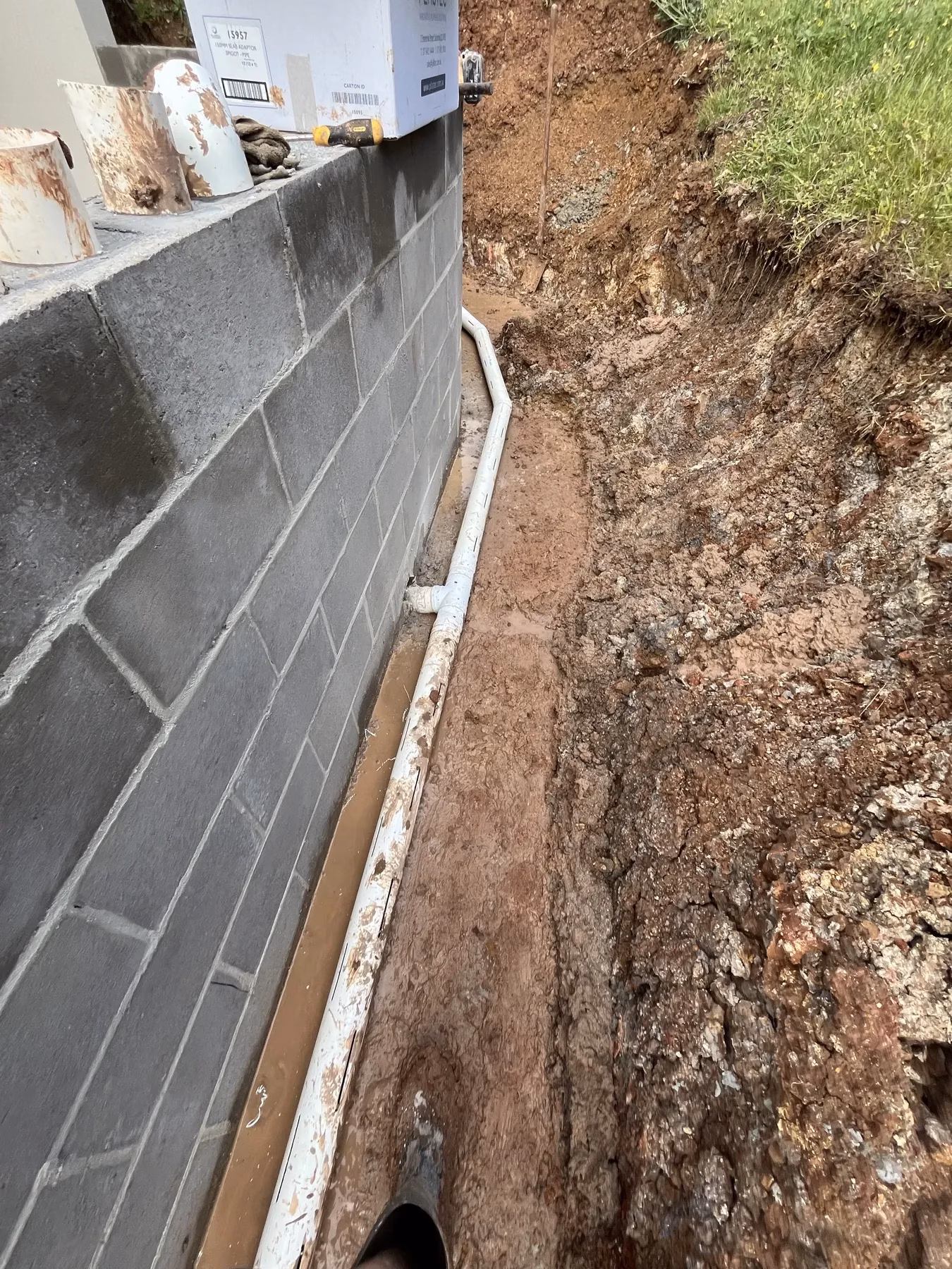 Below-ground drainage beside a masonry wall